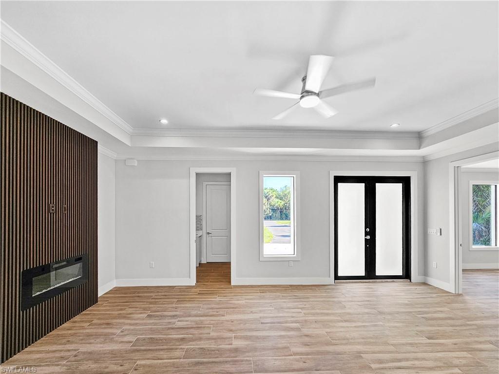 2997 28th Avenue Southeast Naples, FL 34117 - Photo 15 of 49 wooden floor in an empty room with a window