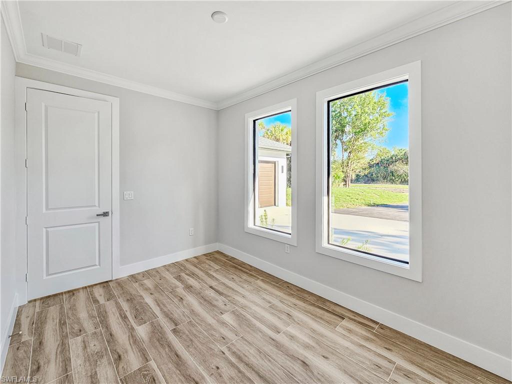 2997 28th Avenue Southeast Naples, FL 34117 - Photo 18 of 49 a view of an empty room with a window