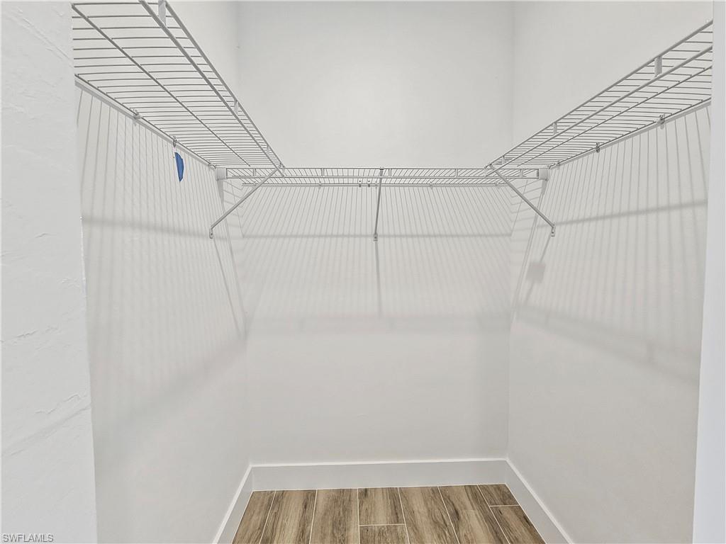 2997 28th Avenue Southeast Naples, FL 34117 - Photo 23 of 49 a view of a room with racks on the wall