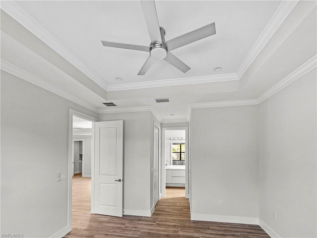 2997 28th Avenue Southeast Naples, FL 34117 - Photo 24 of 49 wooden floor in an empty room