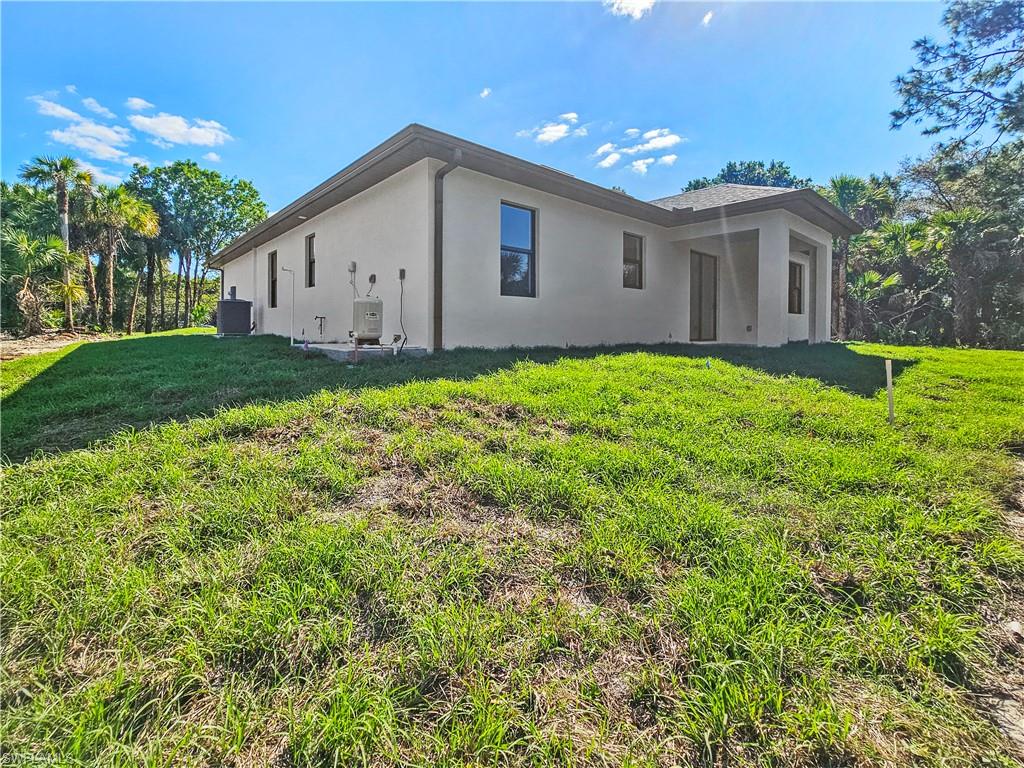 2997 28th Avenue Southeast Naples, FL 34117 - Photo 43 of 49 a view of a backyard of the house