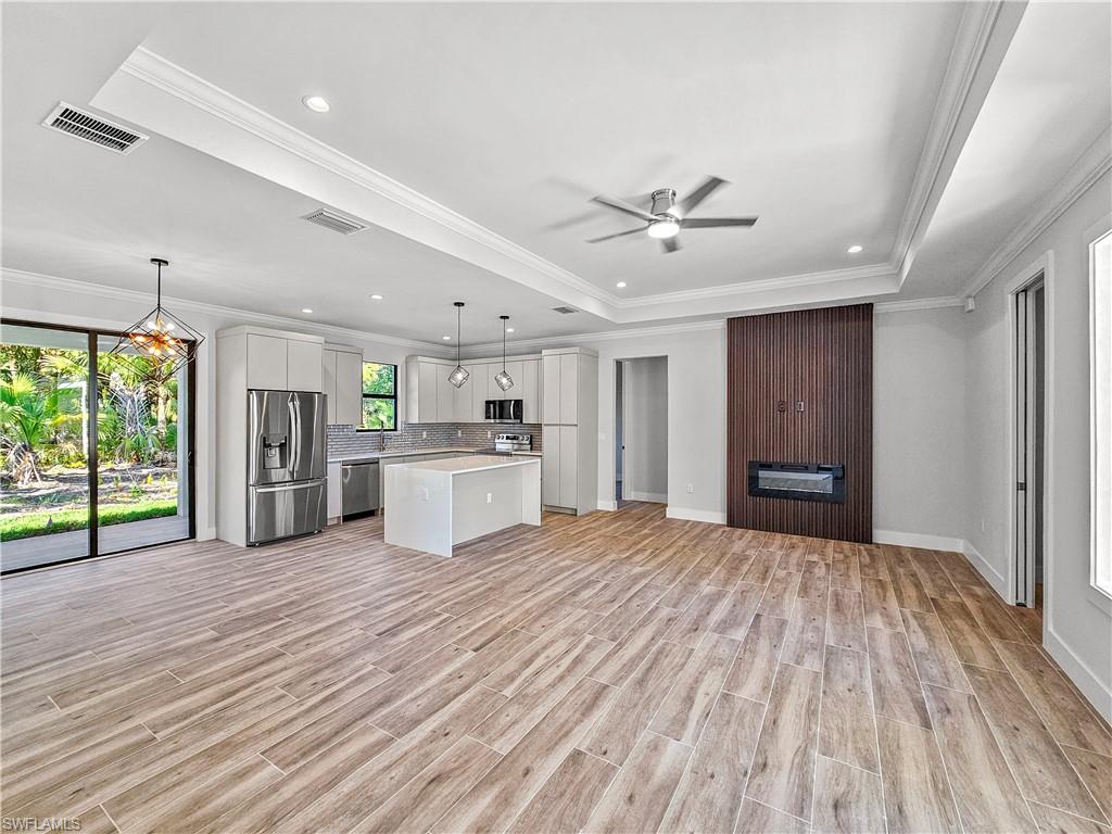 2997 28th Avenue Southeast Naples, FL 34117 - Photo 6 of 49 a view of a kitchen with a stove cabinets and a kitchen
