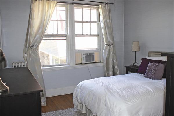 19 Colliston Road, Unit 9 Boston, MA 02135 - Photo 4 of 4 a bedroom with a bed and a window