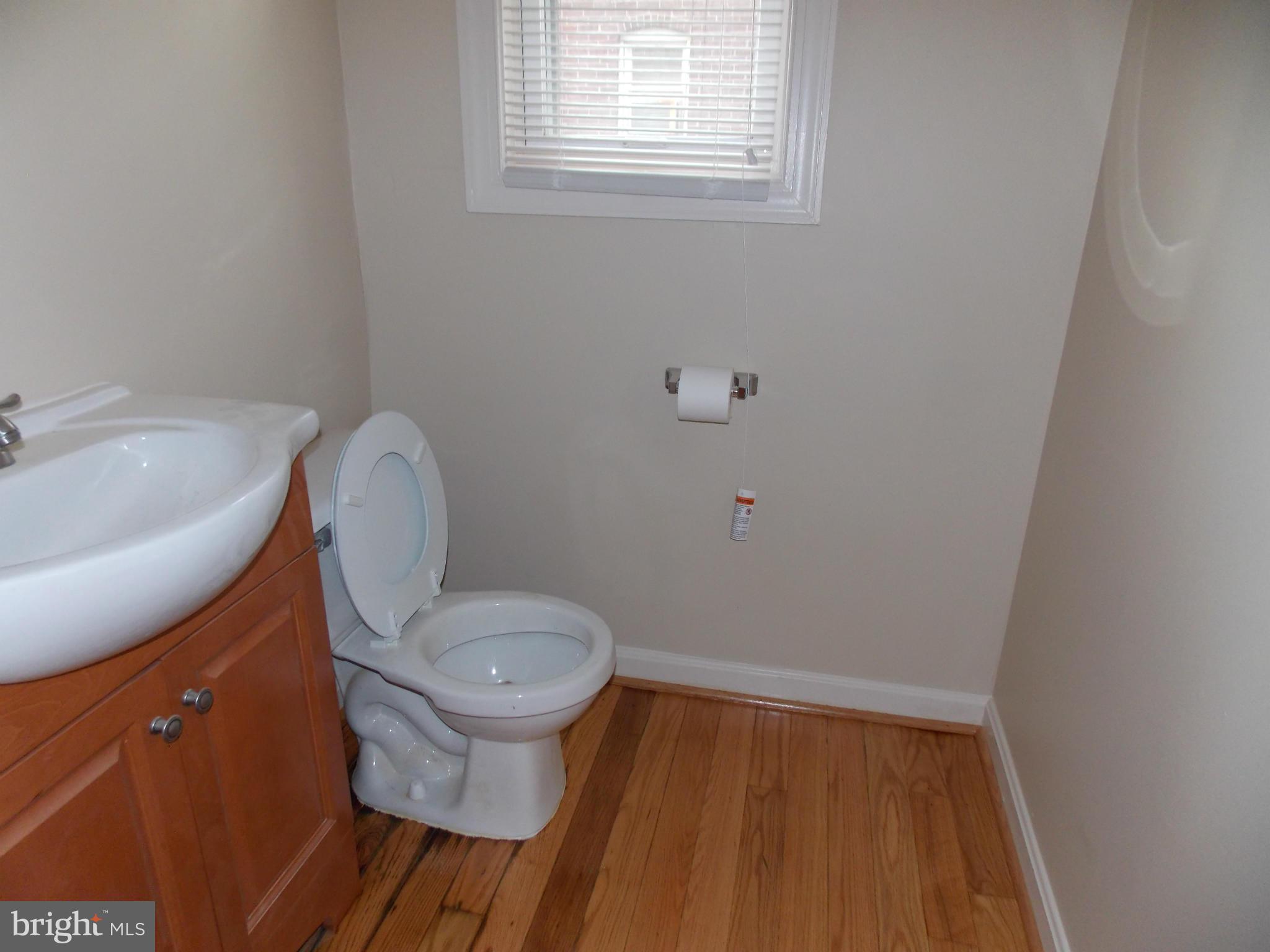 754 Charing Cross Road Baltimore, MD 21229 - Photo 4 of 15 a bathroom with a toilet and a sink