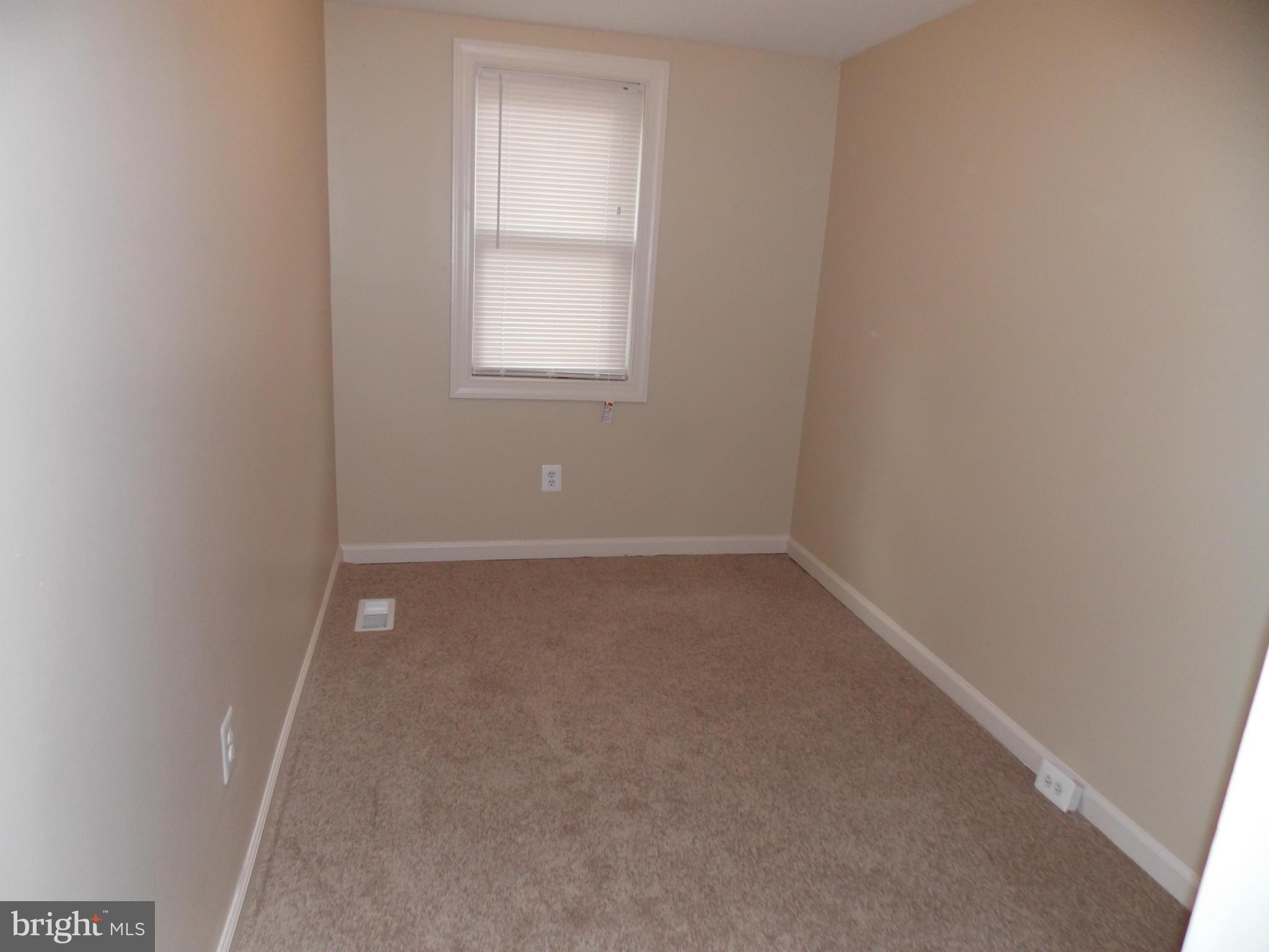 754 Charing Cross Road Baltimore, MD 21229 - Photo 10 of 15 an empty room with a window