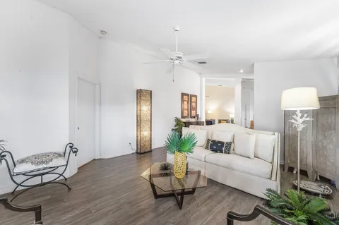 a view of a dining room with furniture wooden floor and chandelier