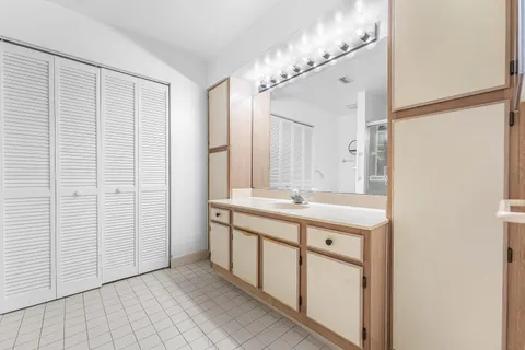 a bedroom with two beds and a window