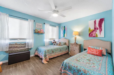 a view of a lake with houses in the back