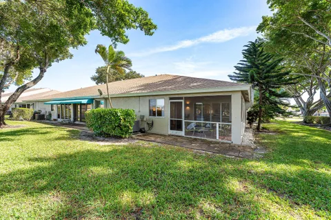 an aerial view of a house with a swimming pool