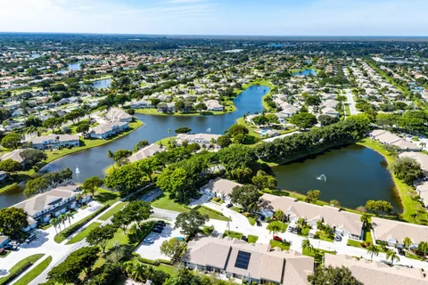 a view of a swimming pool with a table and chairs