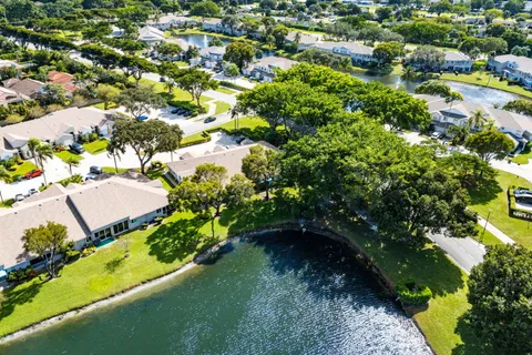 a view of a swimming pool with a yard
