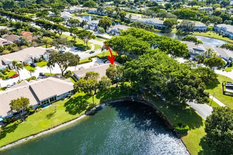 an aerial view of a house with a lake view