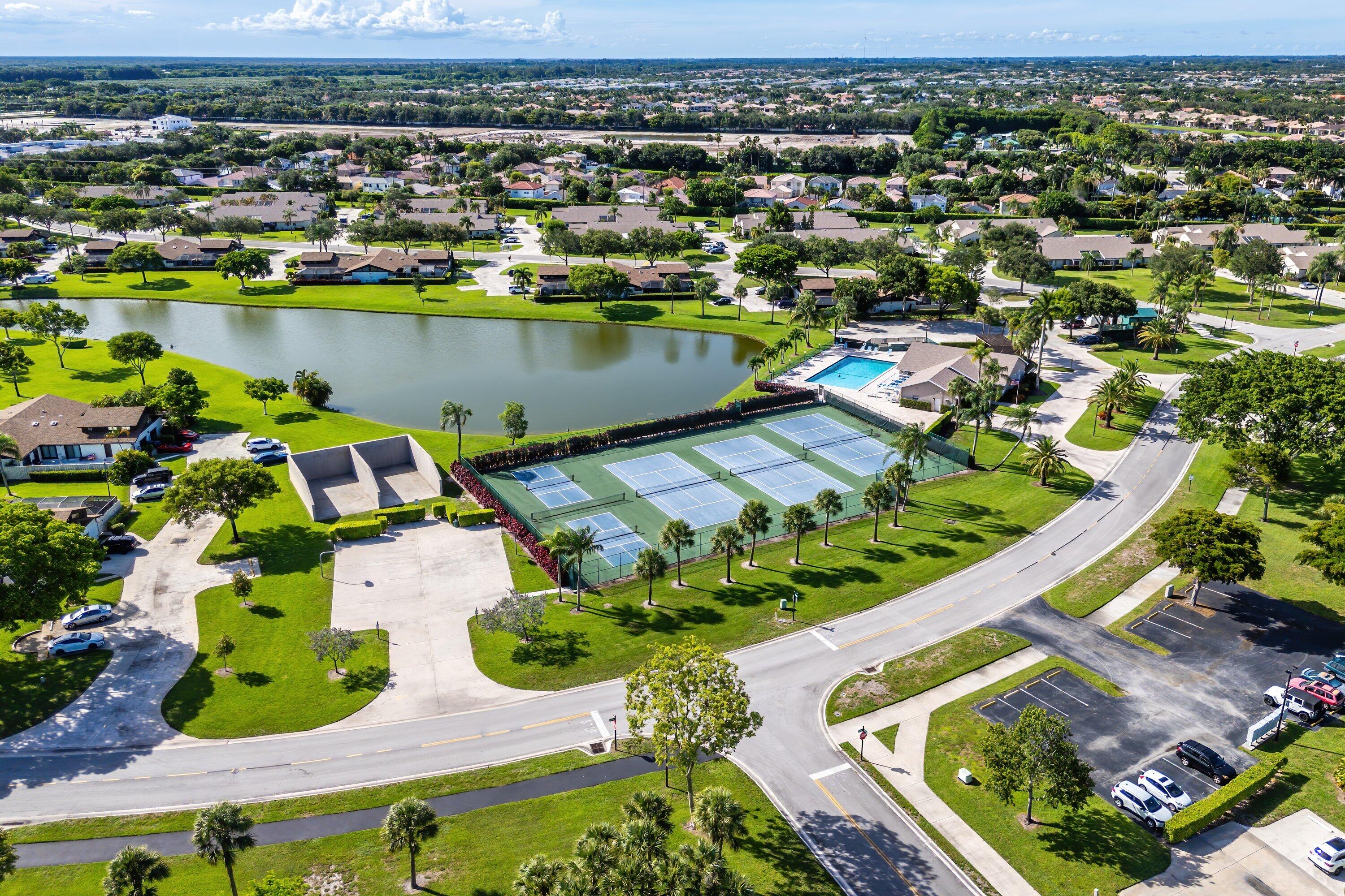9112 Vineland Court, Unit A Boca Raton, FL 33496 - Photo 58 of 62 an aerial view of residential houses with outdoor space