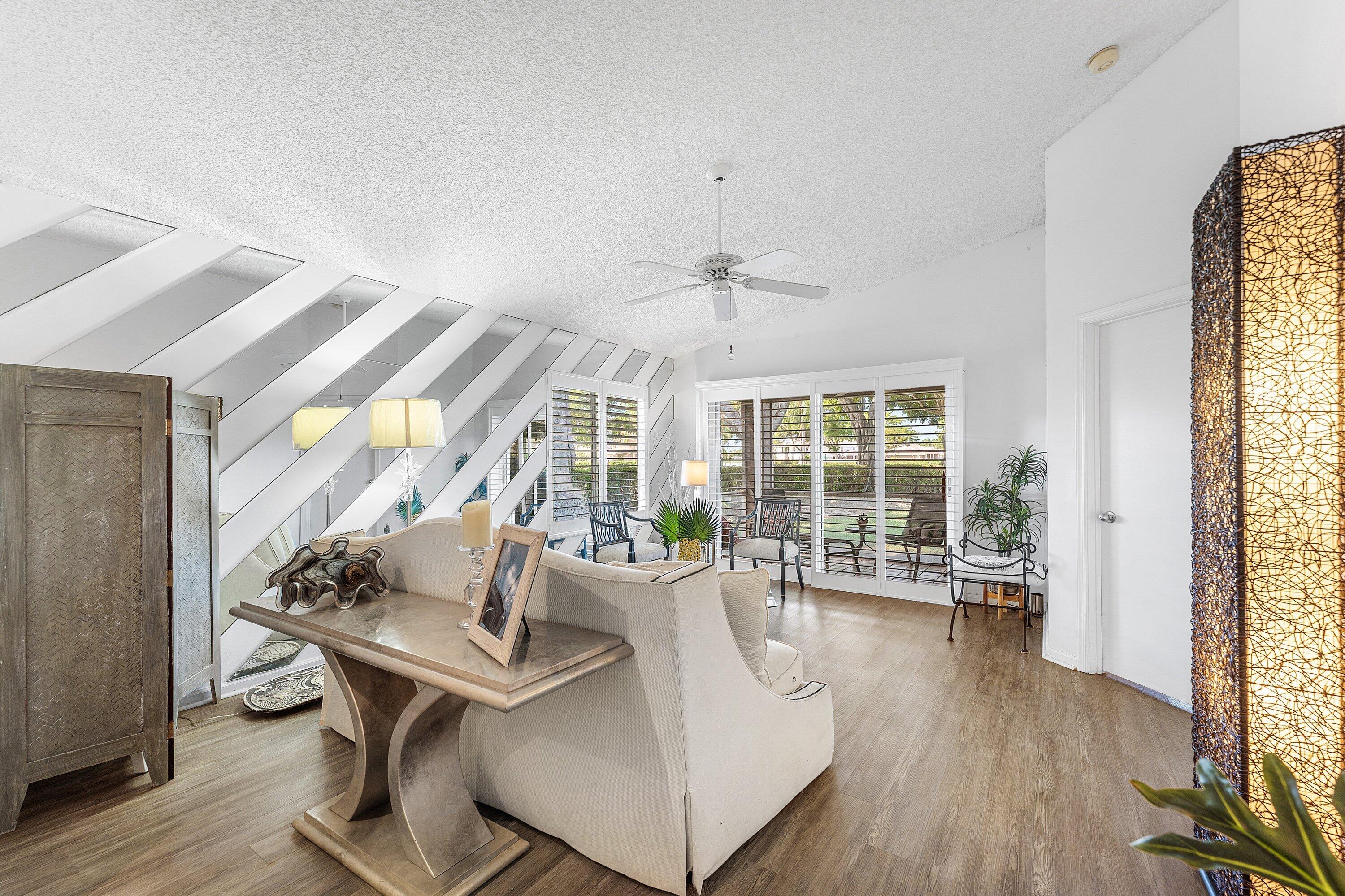 9112 Vineland Court, Unit A Boca Raton, FL 33496 - Photo 7 of 62 a living room with furniture and a large window