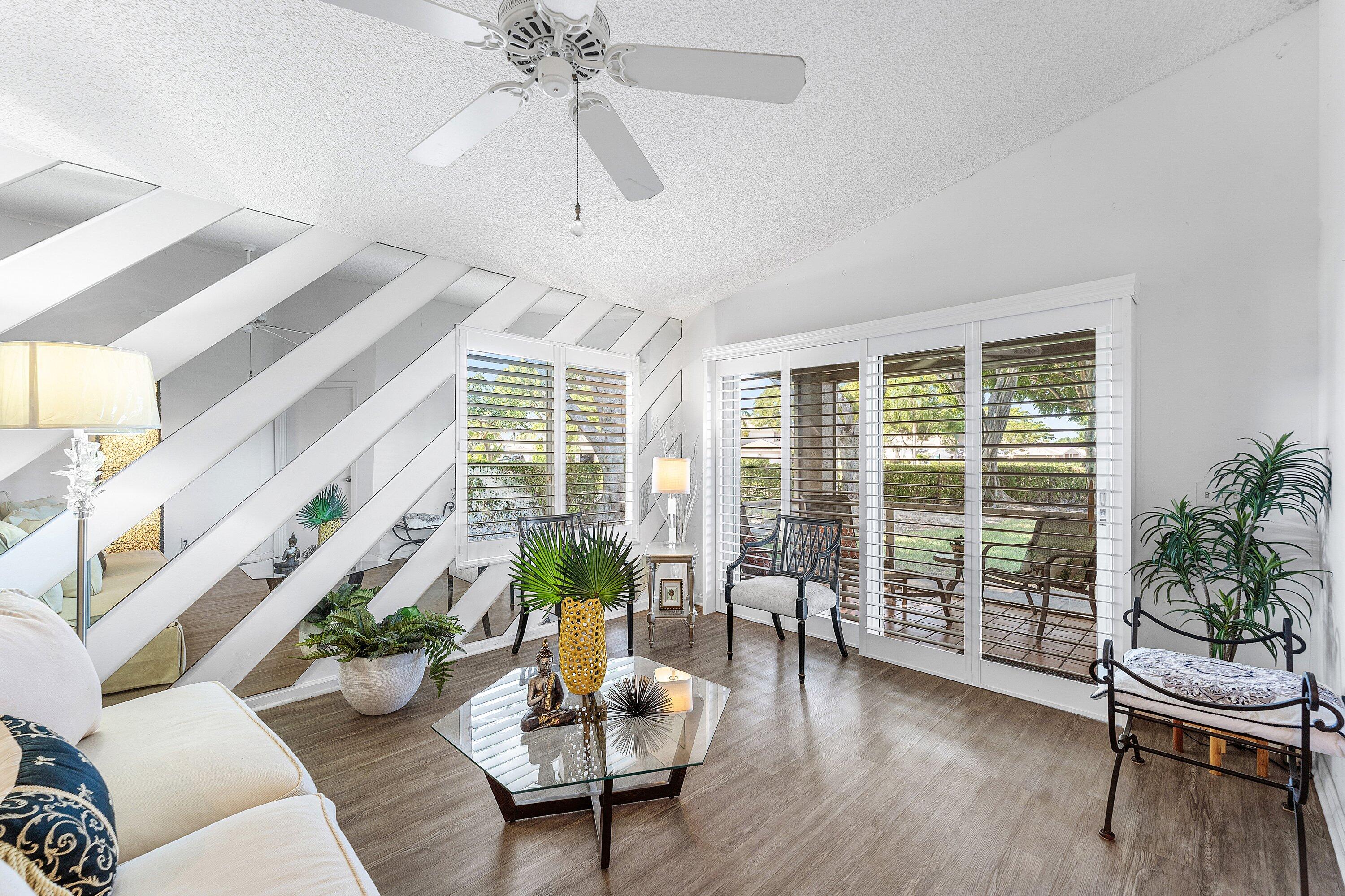 9112 Vineland Court, Unit A Boca Raton, FL 33496 - Photo 8 of 62 a living room with furniture and a large window