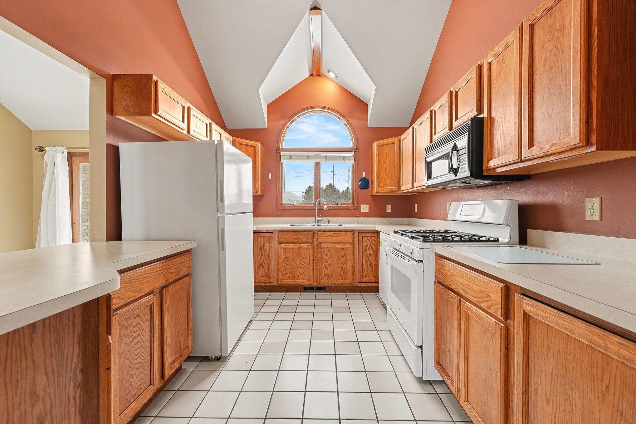 1341 West 94th Court Crown Point, IN 46307 - Photo 15 of 38 a kitchen with stainless steel appliances granite countertop a sink and a cabinets