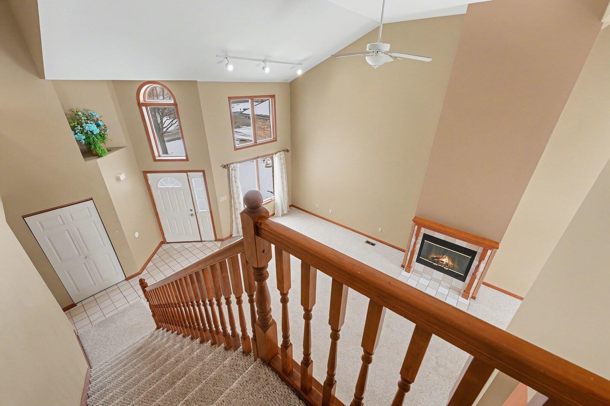 1341 West 94th Court Crown Point, IN 46307 - Photo 18 of 38 a view of entryway with stairs and wooden floor