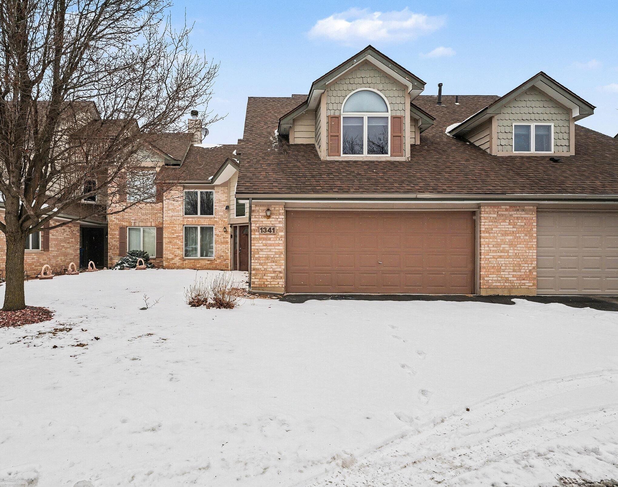 1341 West 94th Court Crown Point, IN 46307 - Photo 2 of 38 a front view of a house with a yard