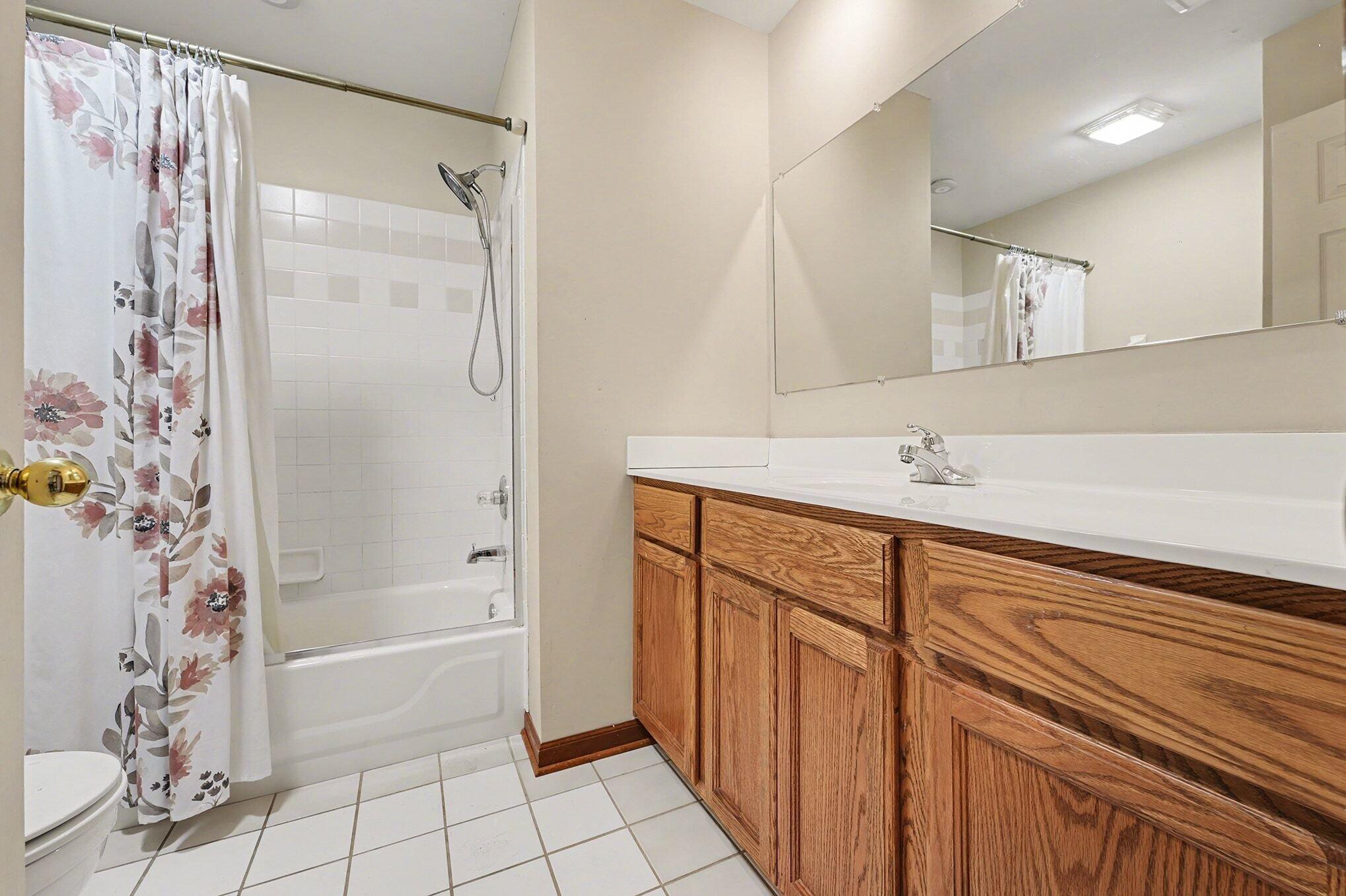 1341 West 94th Court Crown Point, IN 46307 - Photo 23 of 38 a bathroom with a bathtub and a shower