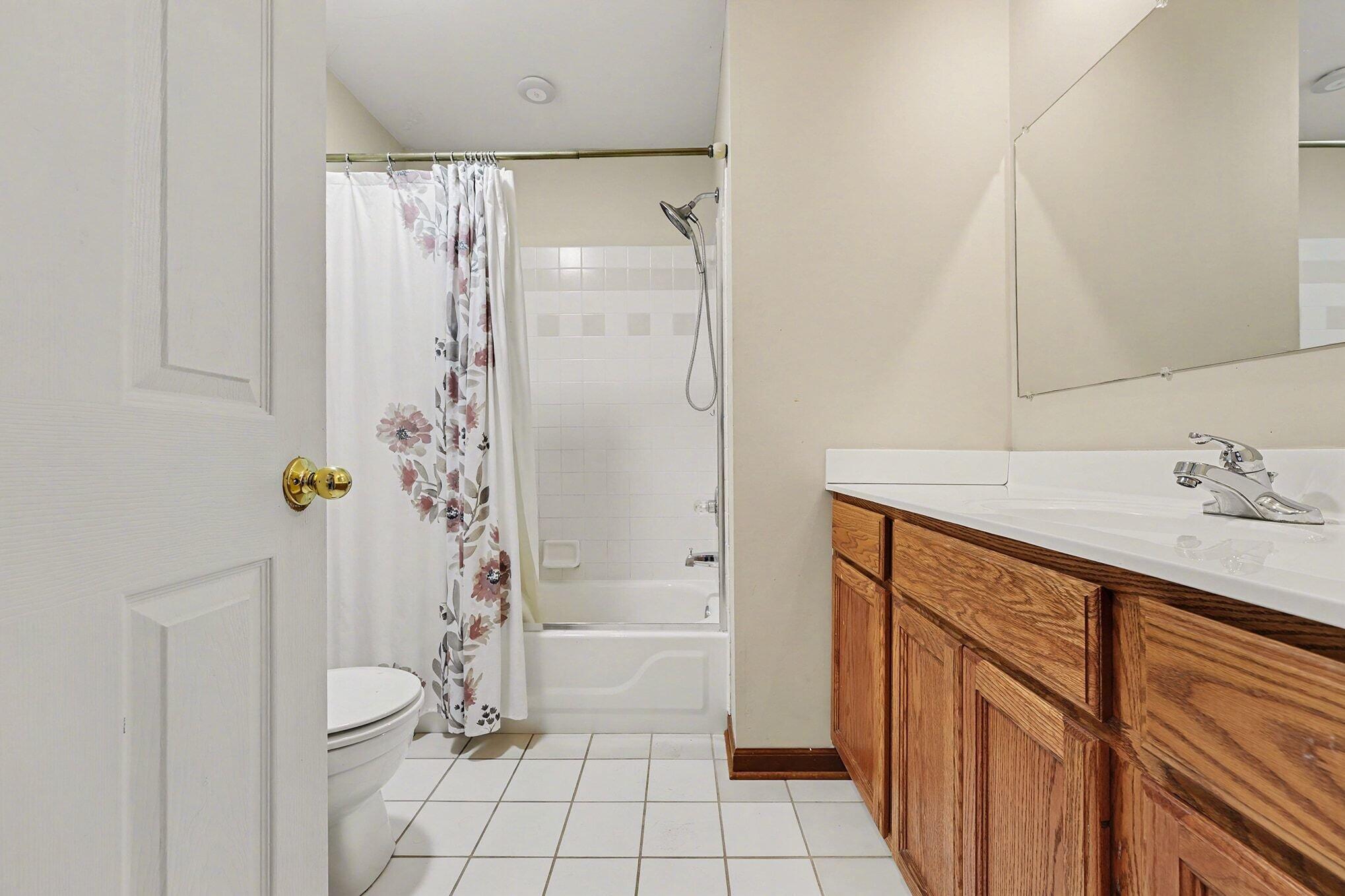 1341 West 94th Court Crown Point, IN 46307 - Photo 24 of 38 a bathroom with a shower sink and toilet