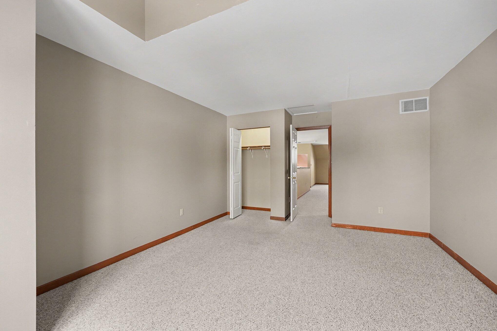 1341 West 94th Court Crown Point, IN 46307 - Photo 26 of 38 a view of an empty room with closet and a window