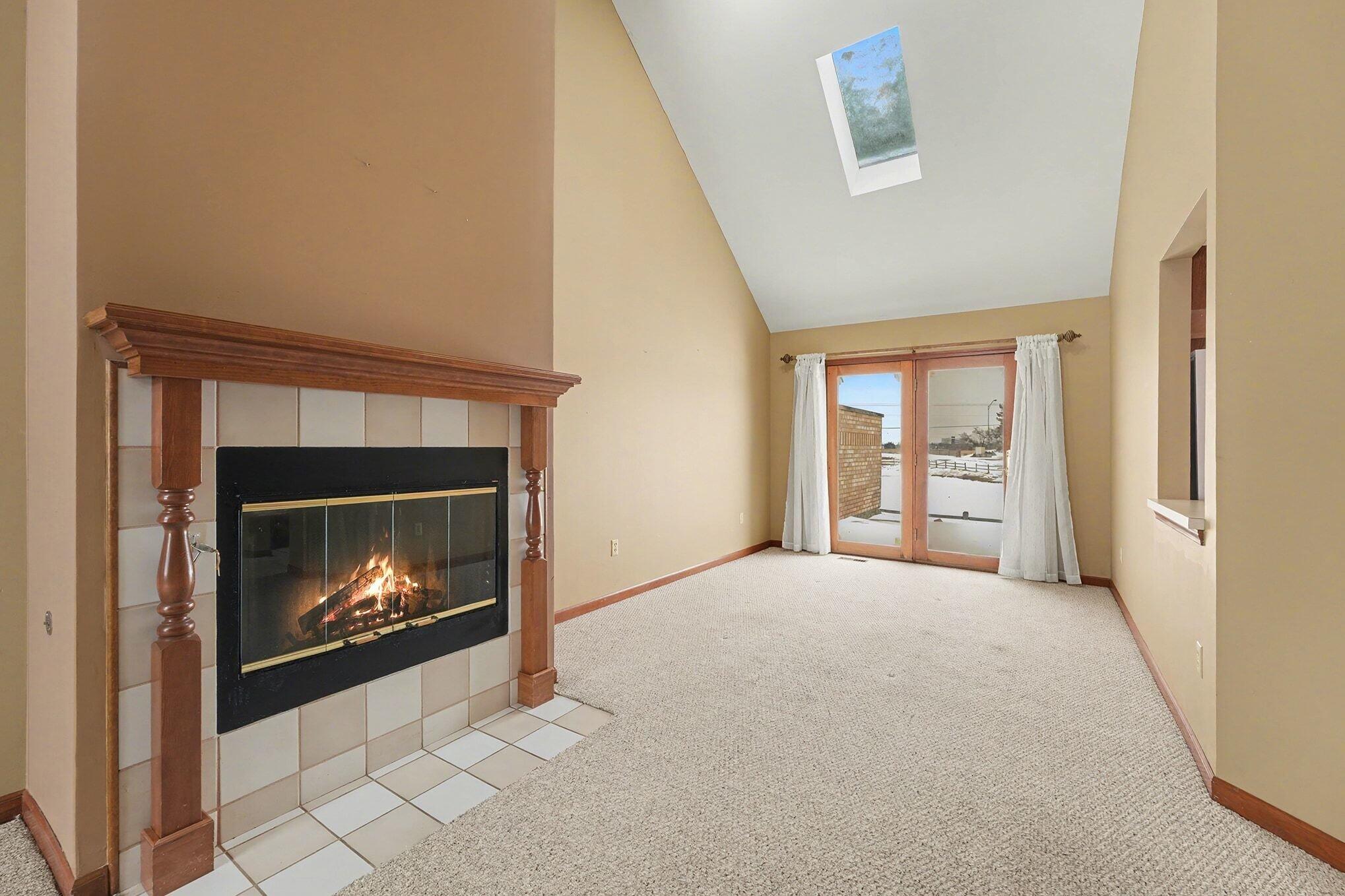 1341 West 94th Court Crown Point, IN 46307 - Photo 9 of 38 a view of an empty room with fire place and a fireplace