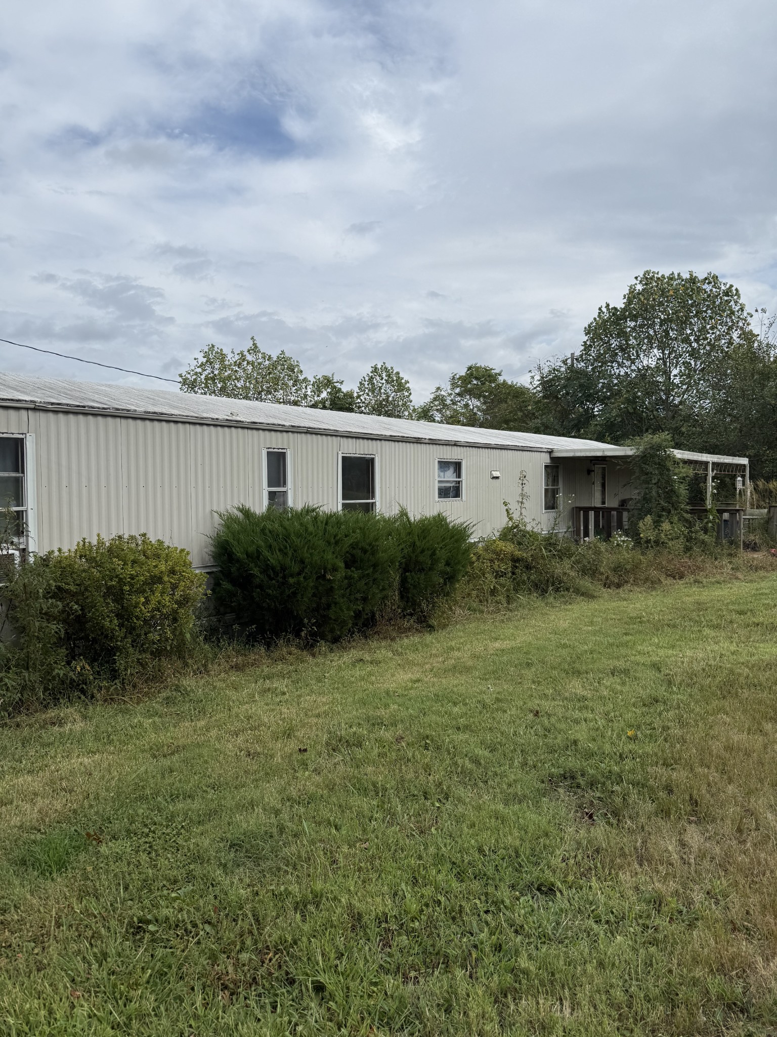 80 Manion Road Lafayette, TN 37083 - Photo 4 of 15 a view of a house with a backyard