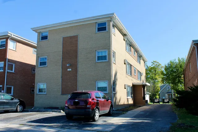 a front view of a house with parking