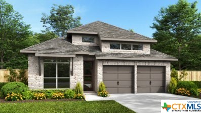 655 Vireos Street New Braunfels, TX 78132 - Photo 1 of 1 a front view of a house with a yard and garage