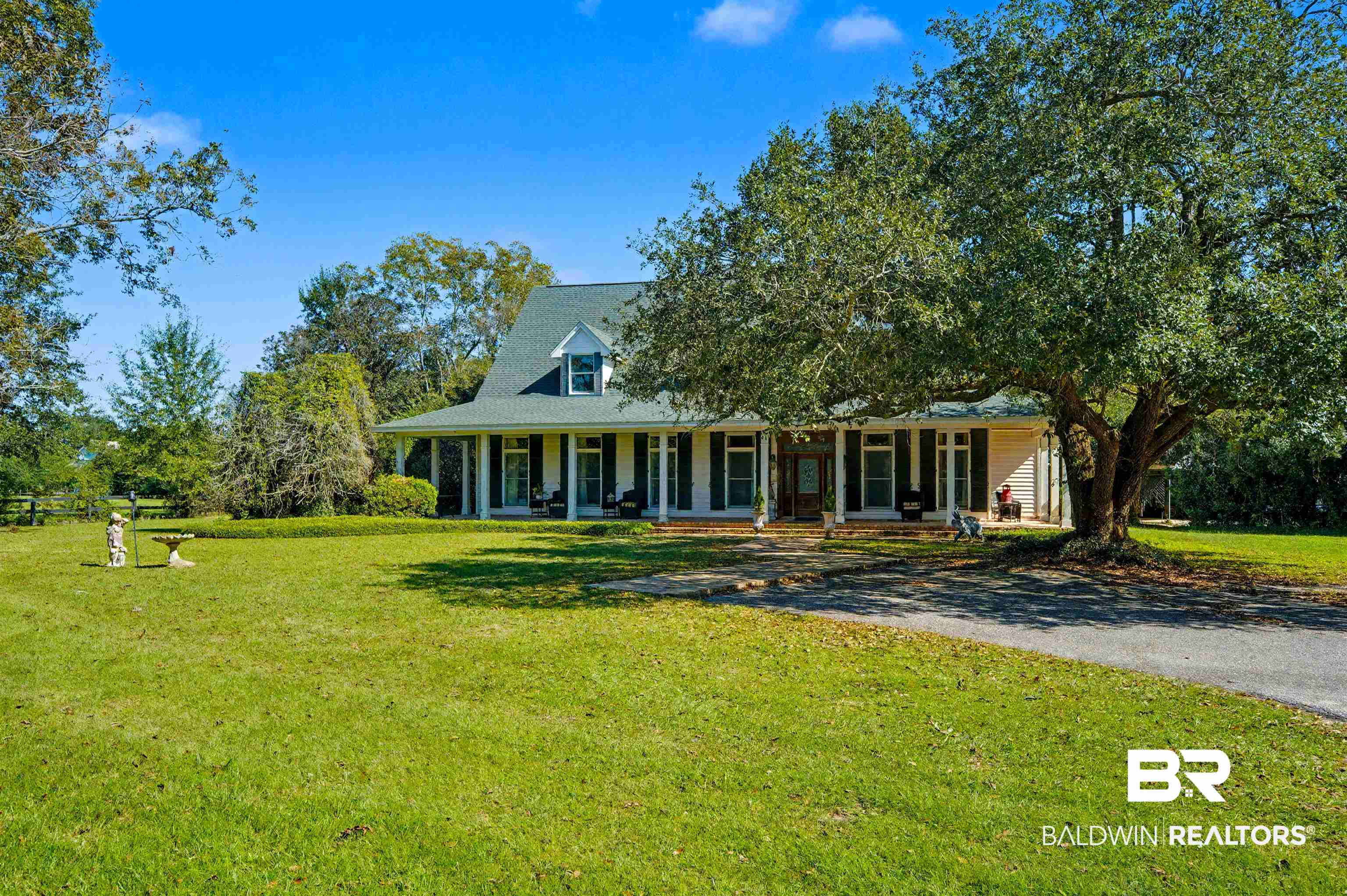 15810 County Road 73 Foley, AL 36535 - Photo 3 of 56 View of front of home featuring a porch and a front yard