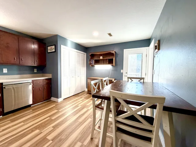 a room with furniture a flat screen tv and a table