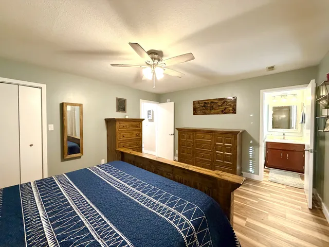 a bedroom with a bed and a dresser