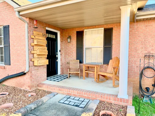 a balcony with furniture and a window