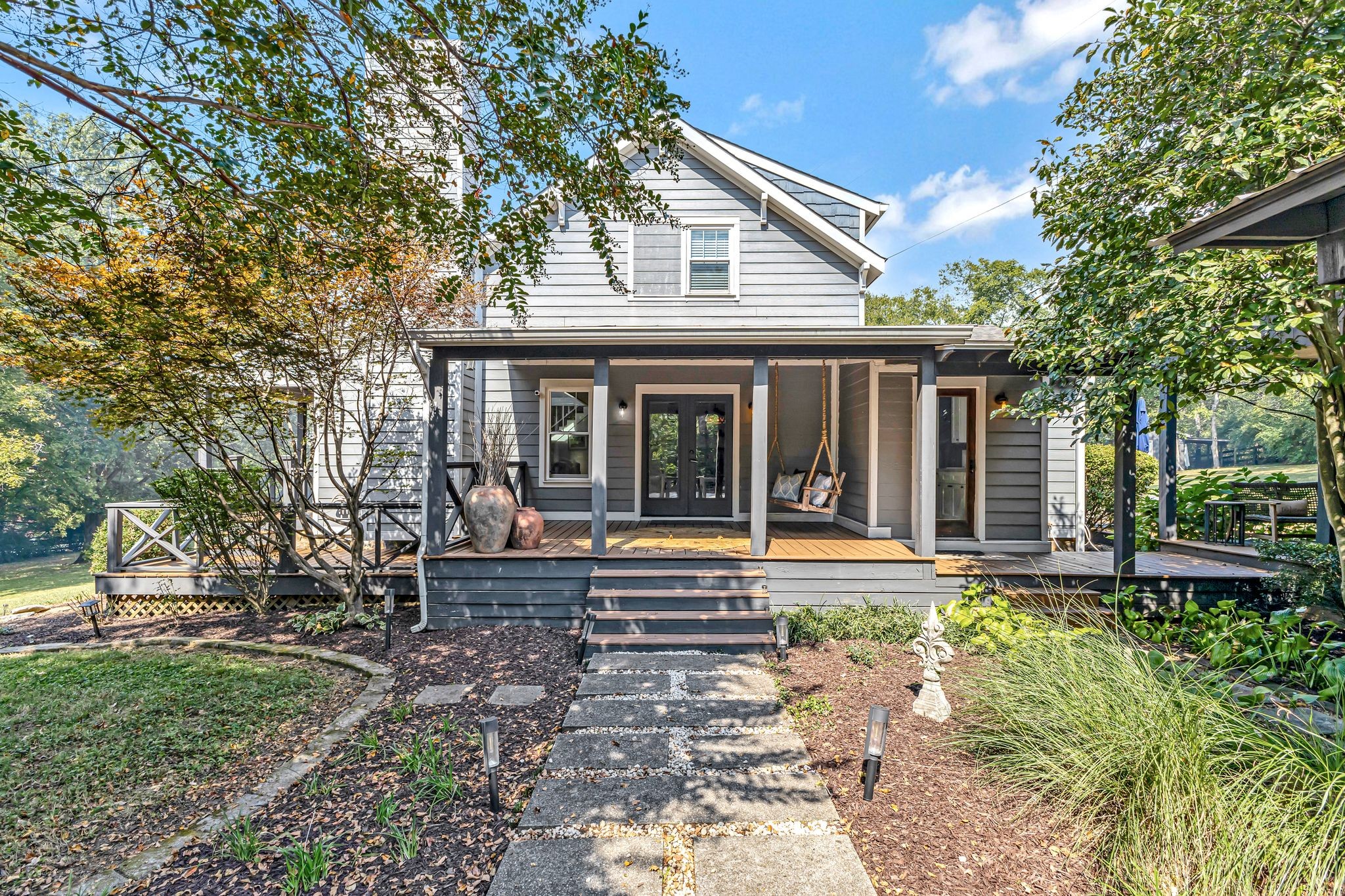 a front view of a house with garden