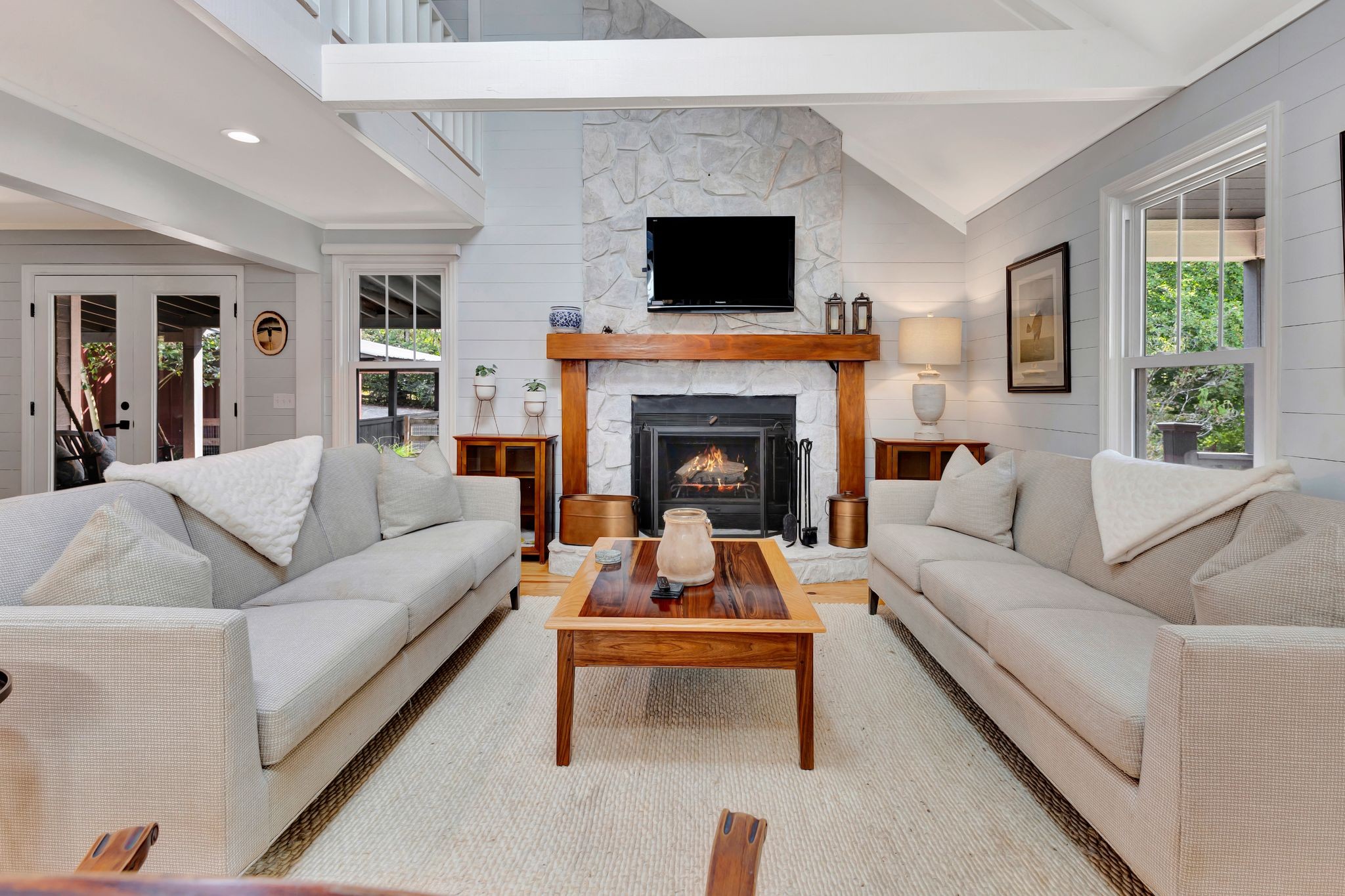 1358 Hunter Road Franklin, TN 37064 - Photo 12 of 47 a living room with furniture a flat screen tv and a fireplace