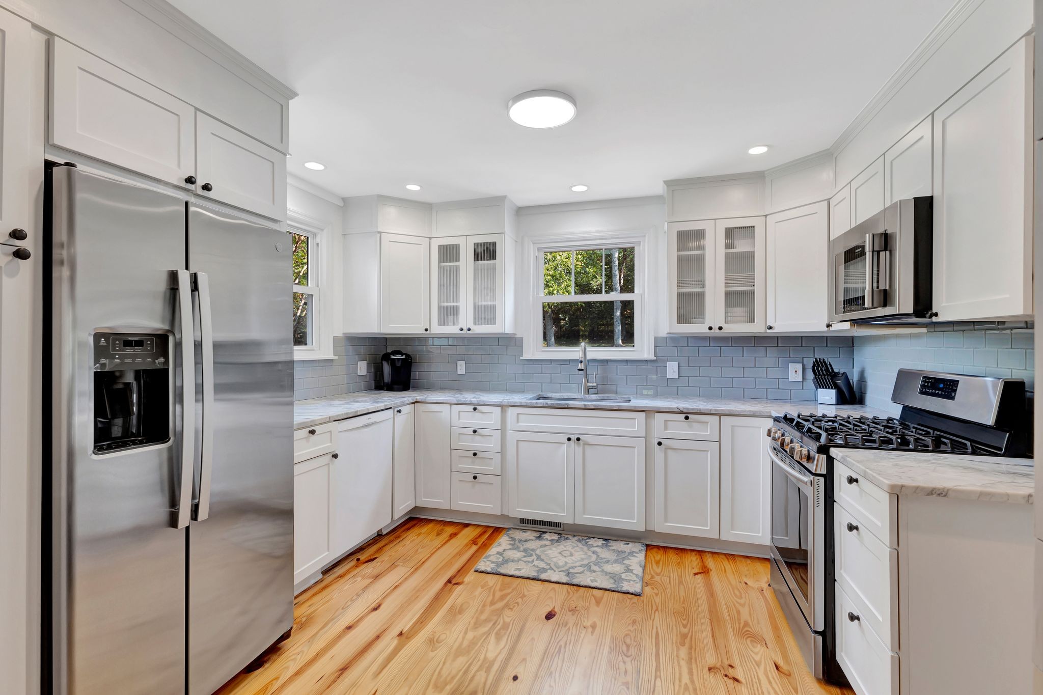 1358 Hunter Road Franklin, TN 37064 - Photo 15 of 47 a large kitchen with stainless steel appliances granite countertop a stove refrigerator and cabinets
