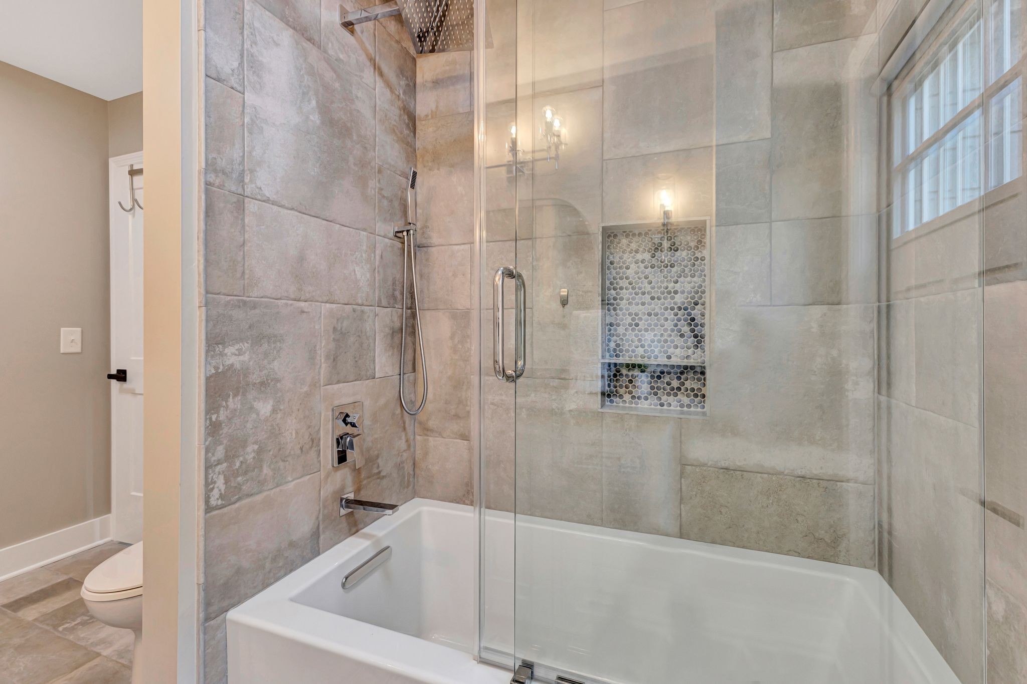 1358 Hunter Road Franklin, TN 37064 - Photo 23 of 47 a bathroom with a bathtub and a shower