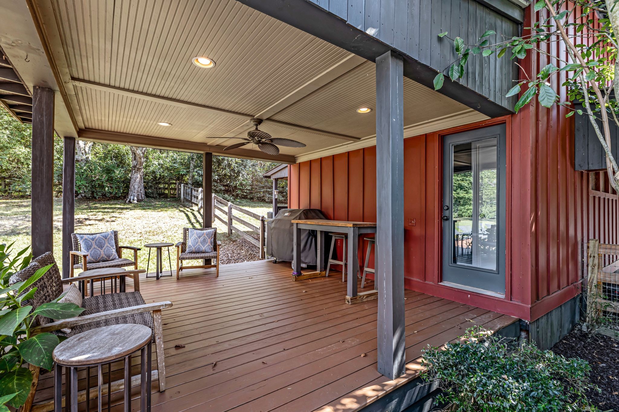 1358 Hunter Road Franklin, TN 37064 - Photo 33 of 47 a view of a patio with table and chairs potted plants with wooden floor and floor to ceiling window