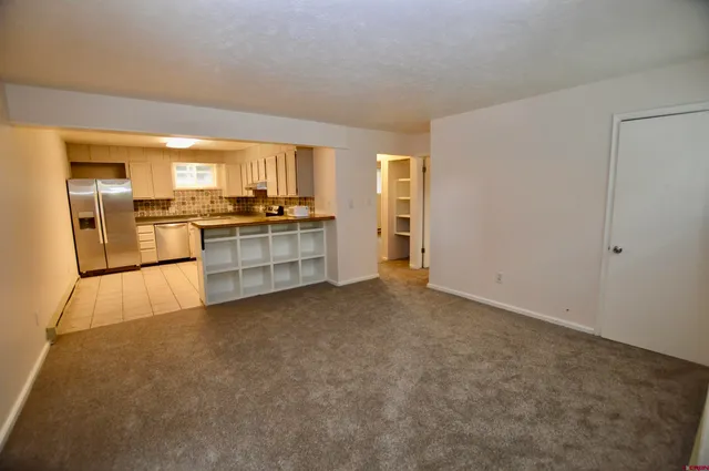 a view of a kitchen with a stove cabinets and a kitchen
