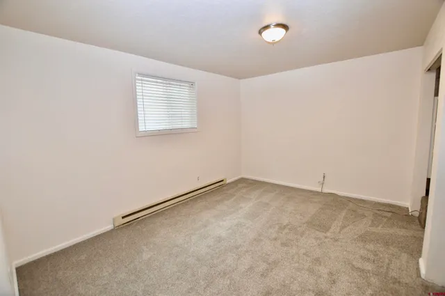 an empty room with a empty space and a window