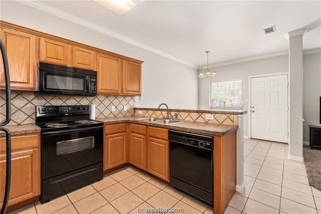 1001 Krenek Tap Road, Unit 2105 College Station, TX 77840 - Photo 9 of 24 Kitchen centrally located for easy access to living and dining