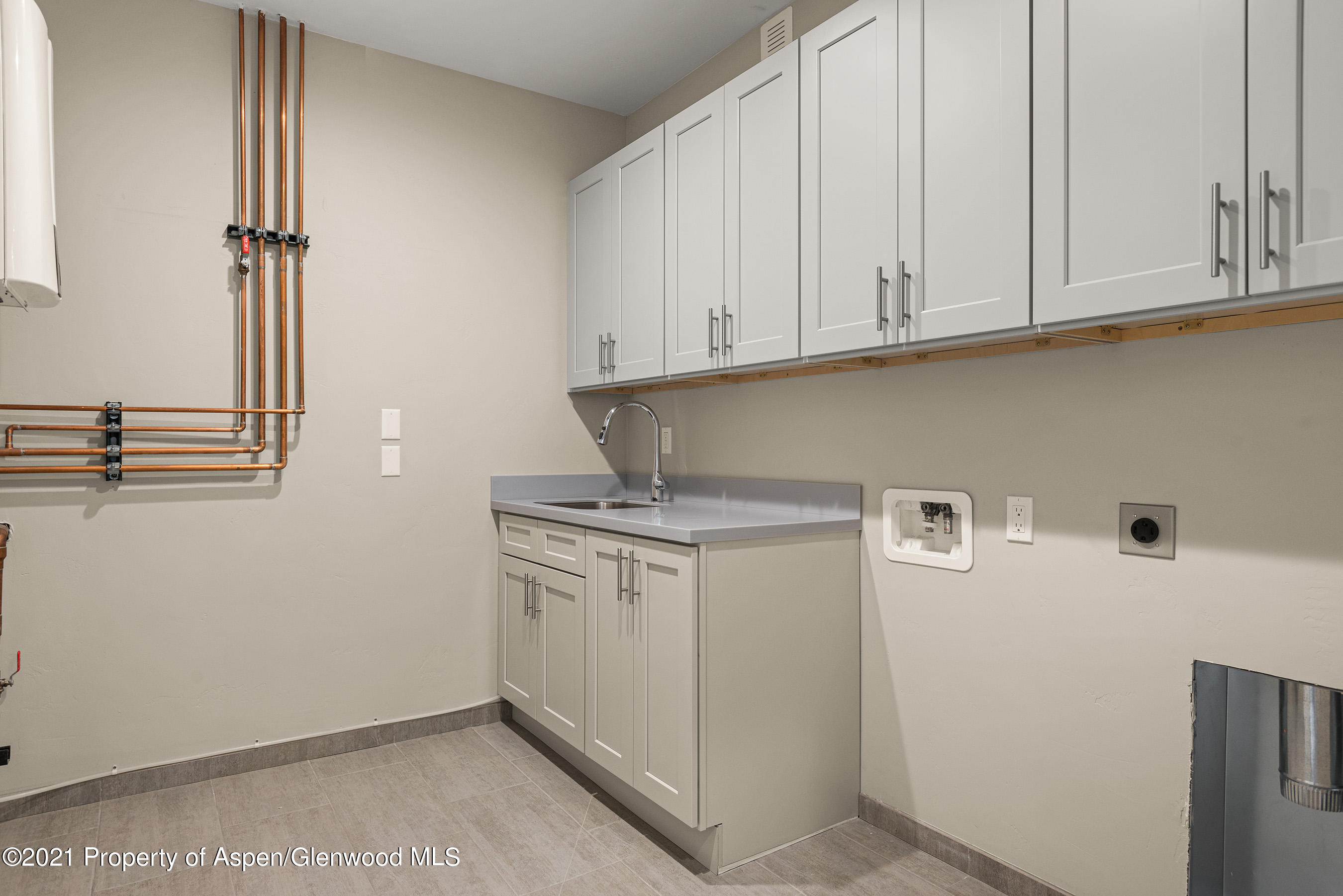 264 Overlook Ridge Carbondale, CO 81623 - Photo 28 of 39 a view of cabinets and dryer