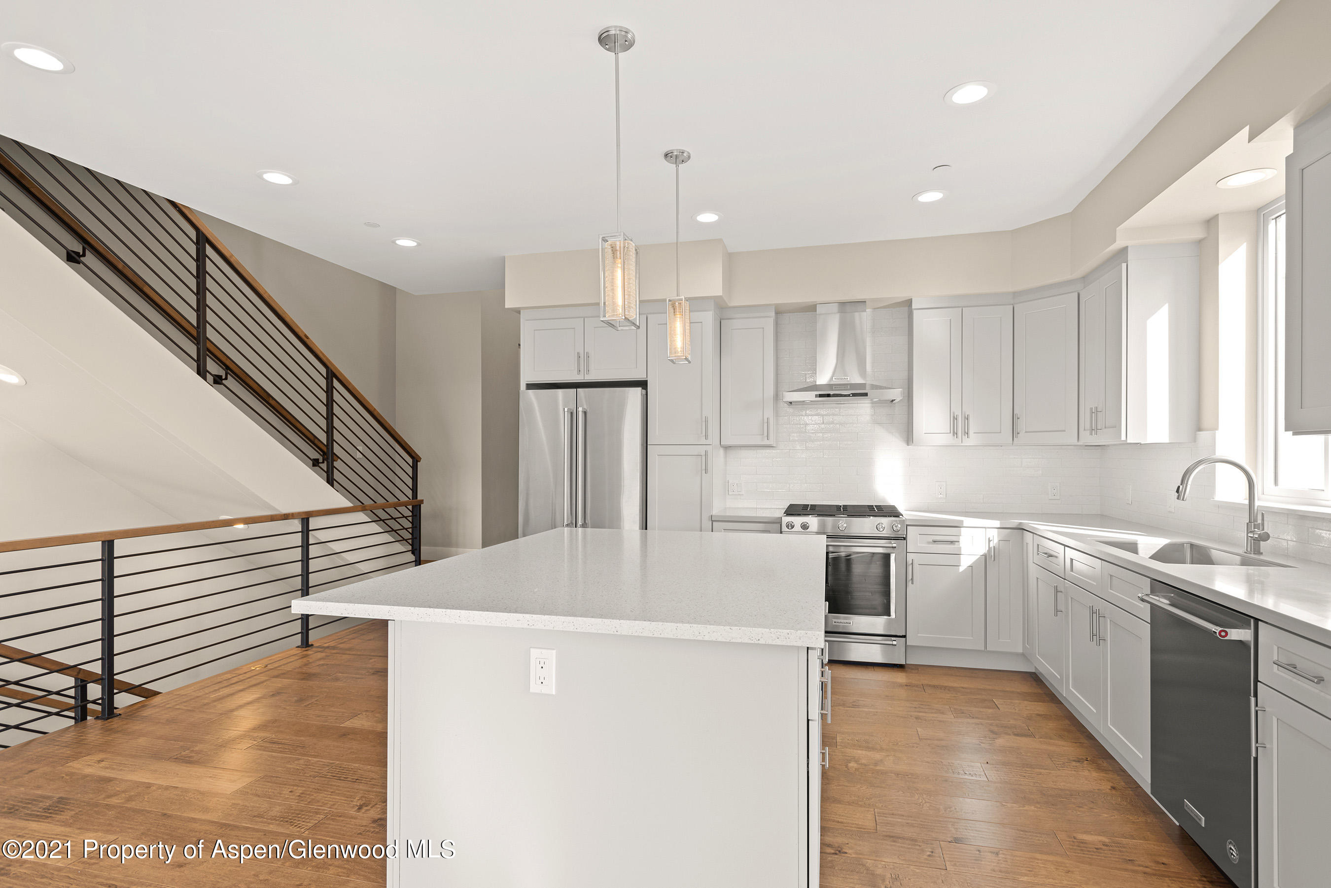 264 Overlook Ridge Carbondale, CO 81623 - Photo 7 of 39 a kitchen with stainless steel appliances granite countertop a sink stove and refrigerator