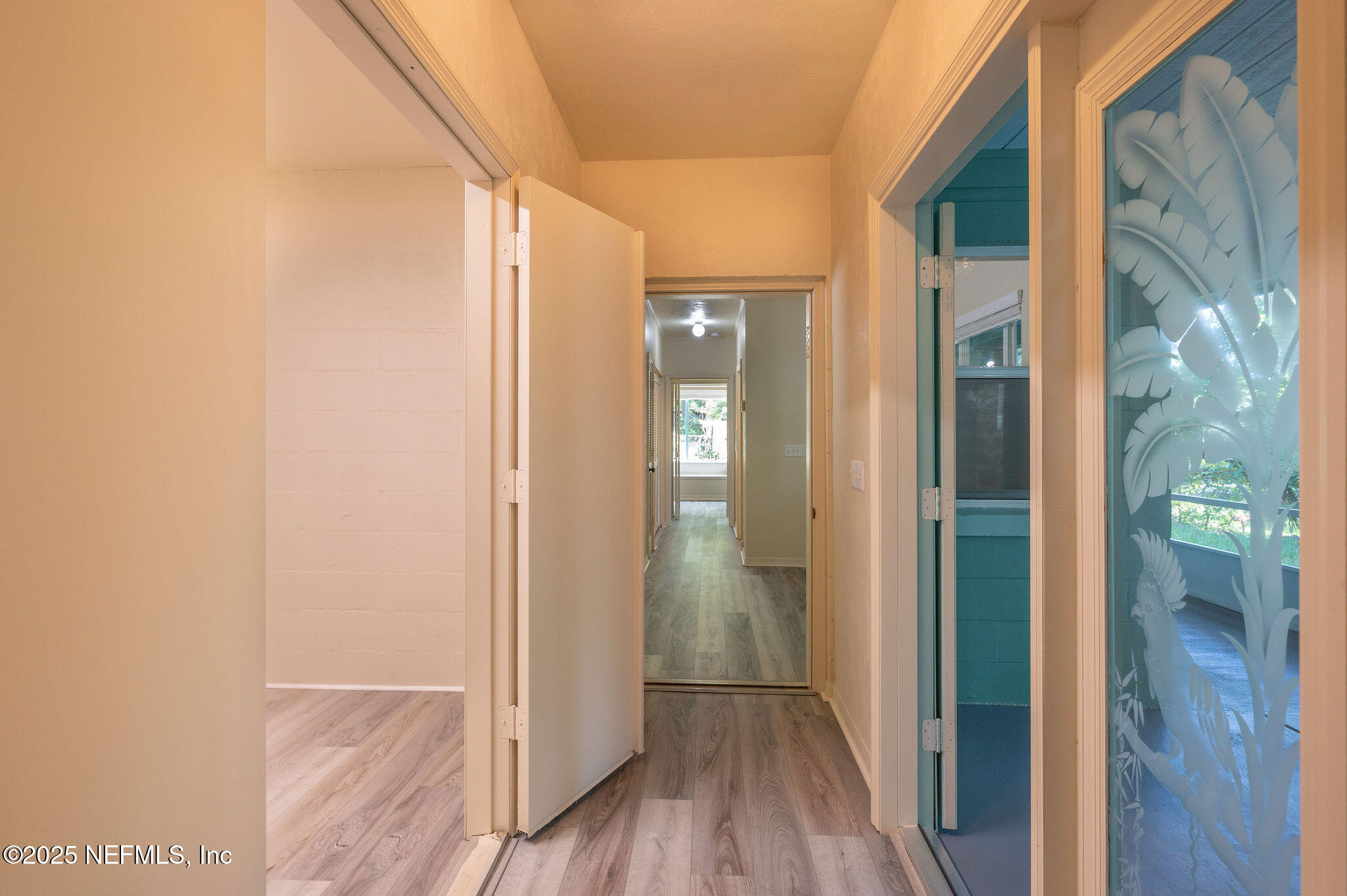 63 Hernandez Avenue Ormond Beach, FL 32174 - Photo 19 of 33 a view of a bathroom from a hallway