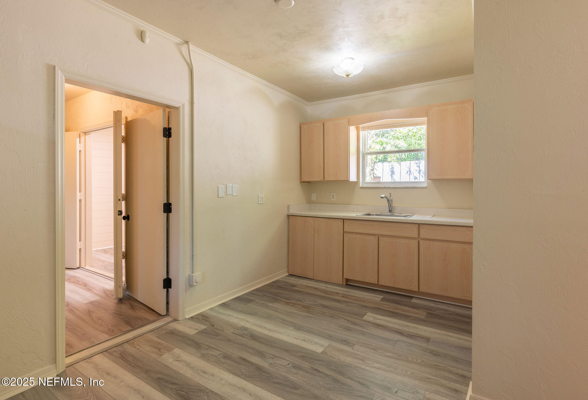 63 Hernandez Avenue Ormond Beach, FL 32174 - Photo 21 of 33 a view of a bathroom with a sink and a window