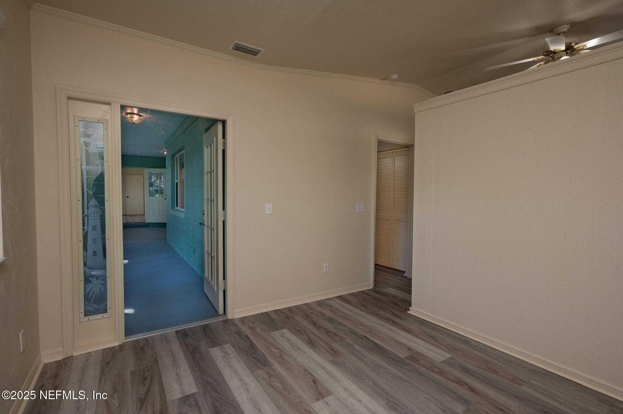 63 Hernandez Avenue Ormond Beach, FL 32174 - Photo 27 of 33 a view of a room with wooden floor and a hallway