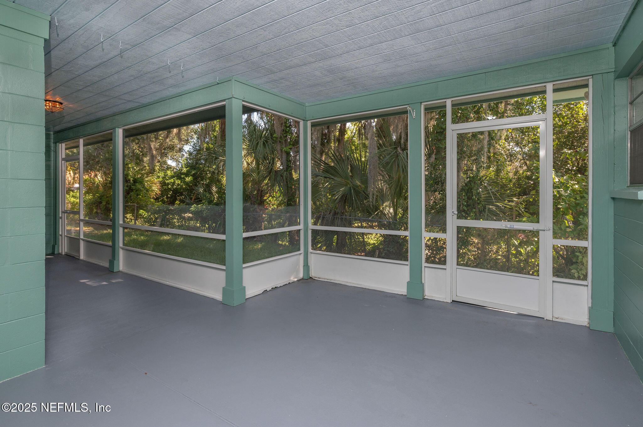 63 Hernandez Avenue Ormond Beach, FL 32174 - Photo 32 of 33 a view of an empty room with windows