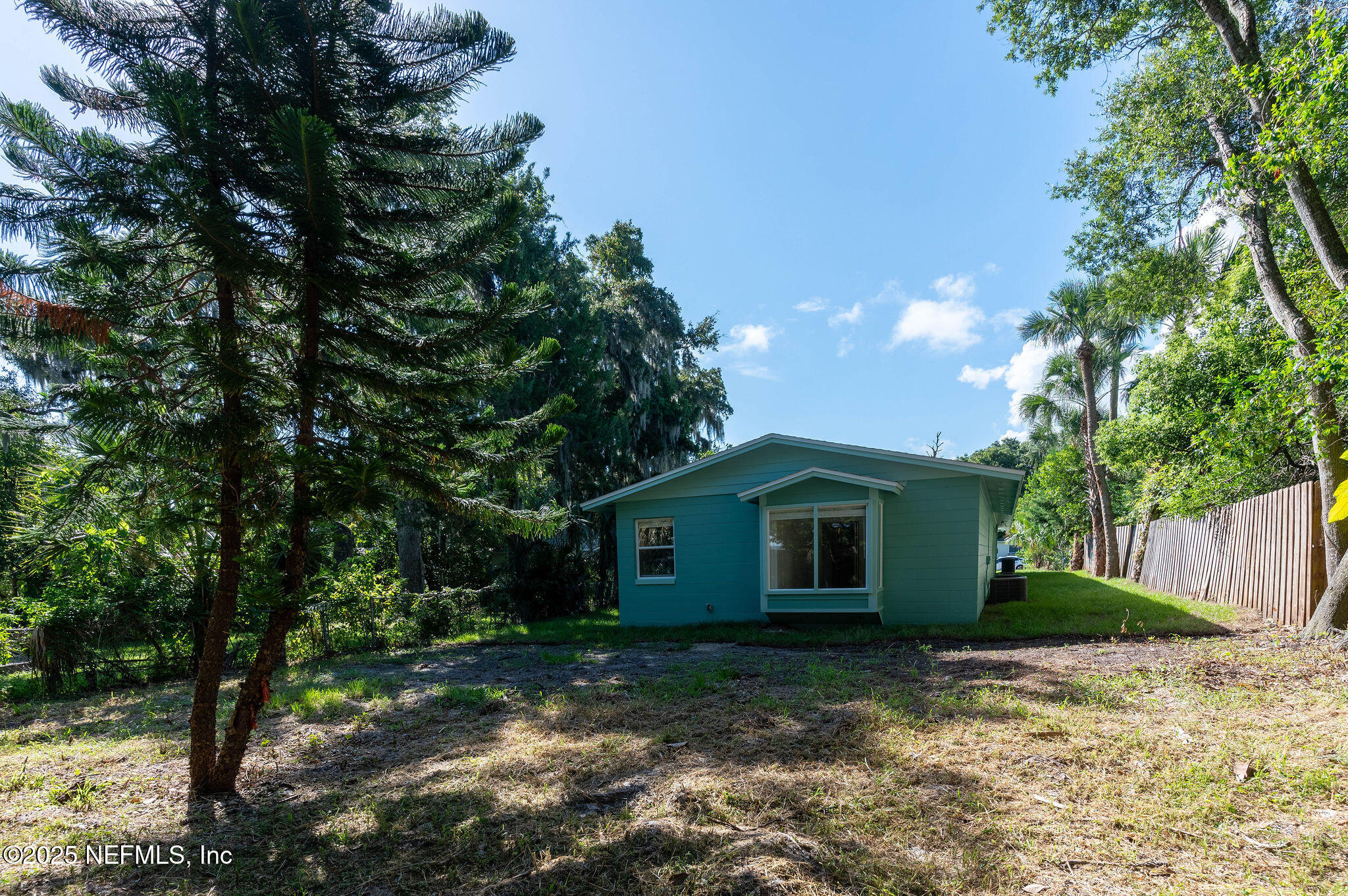 63 Hernandez Avenue Ormond Beach, FL 32174 - Photo 4 of 33 a view of a house with a yard