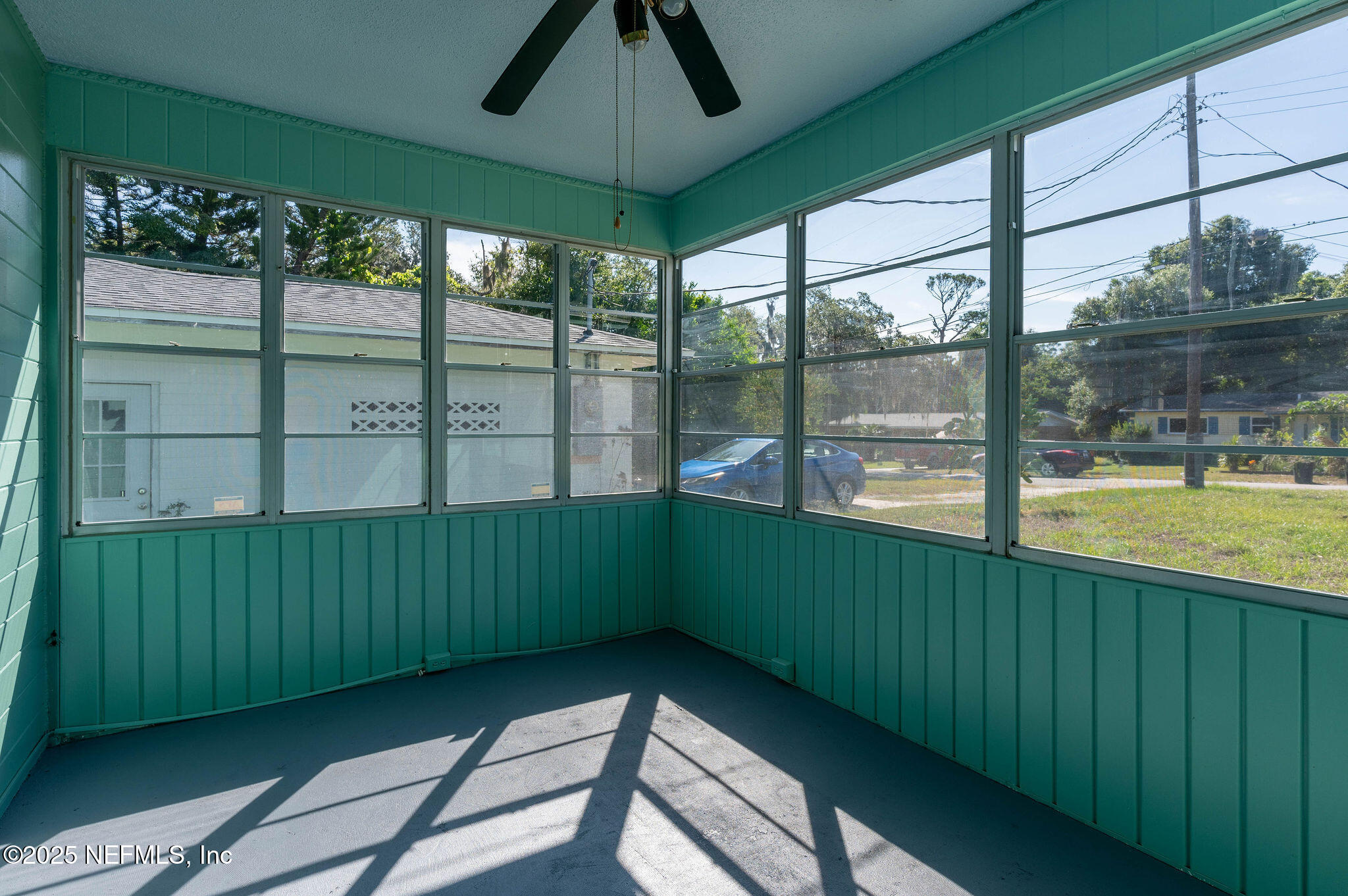 63 Hernandez Avenue Ormond Beach, FL 32174 - Photo 6 of 33 a room with green walls and a large window