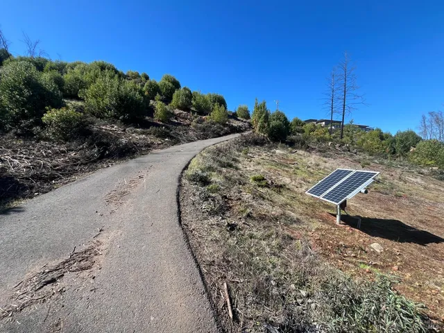 a view of a road with a yard